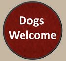 A red circle with the words dogs welcome on it.